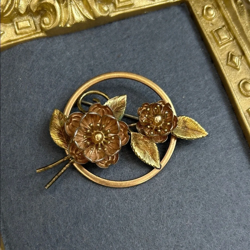 vintage Krementz brooch featuring floral designs in a mixed rose and yellow gold